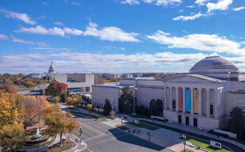 Home Air Filter DC: Aerial view of the National Archives Museum and US Capitol Building in Washington, D.C., on a clear day, showing fall colors.